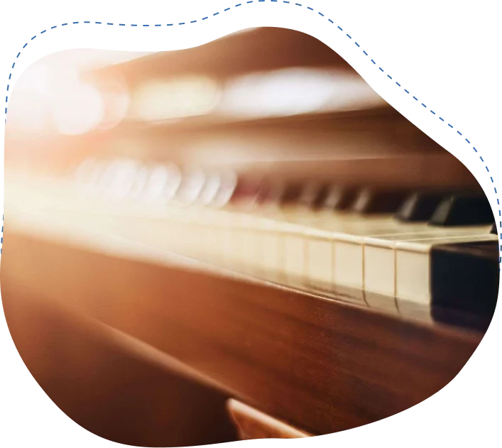 Close-up of piano keys and wooden body, emphasizing delicate design and craftsmanship, relevant to expert piano moving services in Jacksonville.