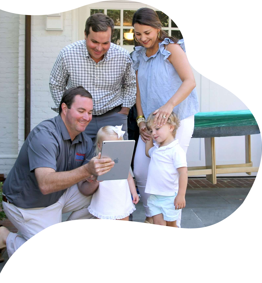 Family interacting with a tablet outdoors, showcasing Skinner Moving & Storage's commitment to customer service and family-friendly moving solutions in Jacksonville.
