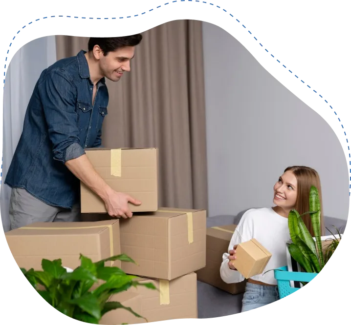 Man and woman packing boxes in a home setting, surrounded by plants, illustrating professional packing services for a stress-free moving experience.